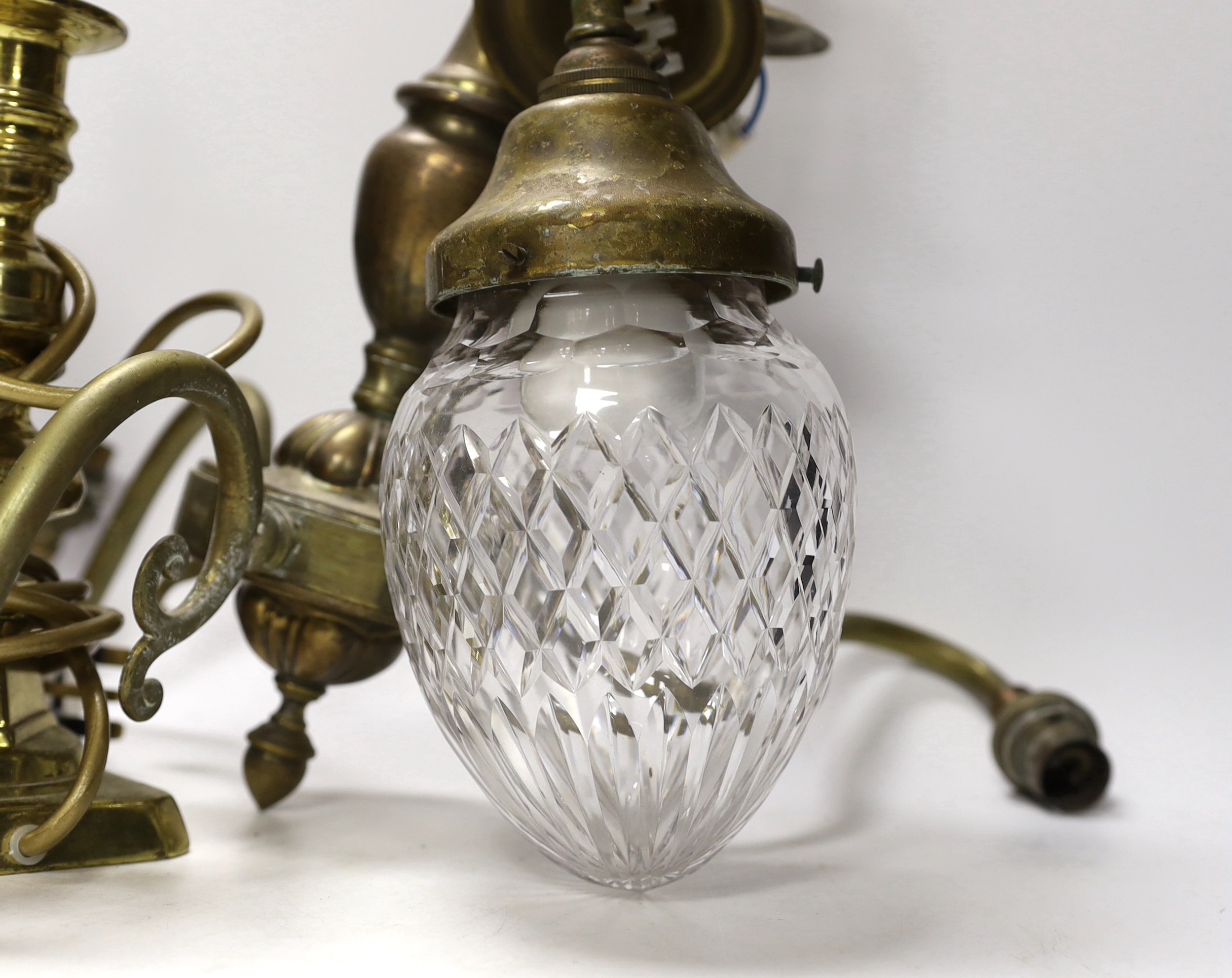 Three brass desk lamps and a three-branch electrolier together with a brass-mounted ceiling light with clear glass shade largest overall 53cm high (5)